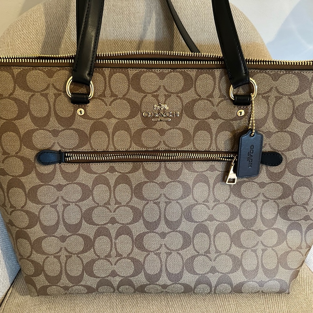 Coach Brown and Black Tote Bag with Monogram Pattern and Structured Shape